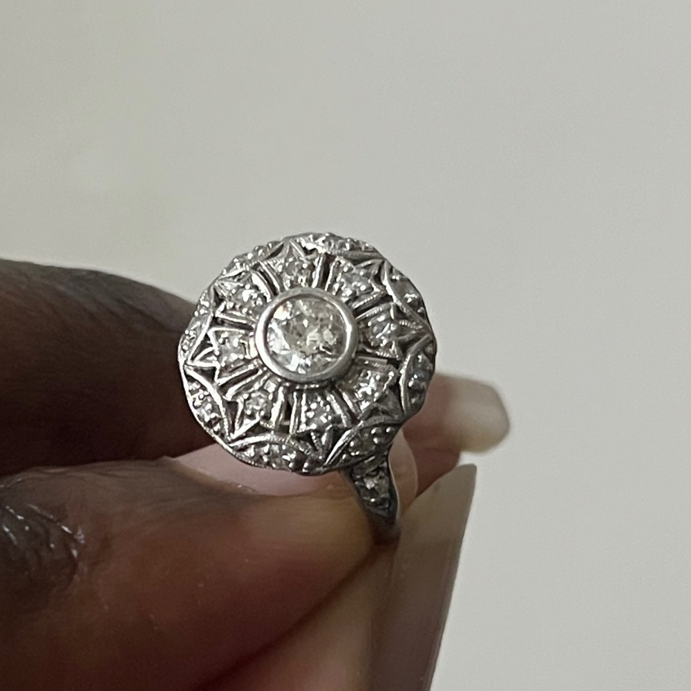 Ornate Platinum Art Deco Ring with intricate designs of European Cut Diamond